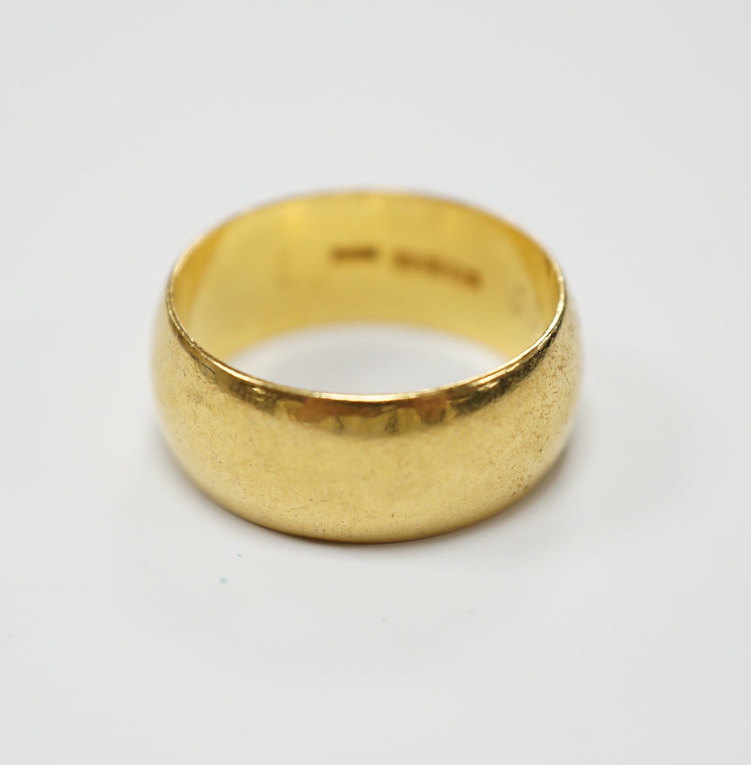 A 1960's 22ct gold wedding band, size L, 7.5 grams.
